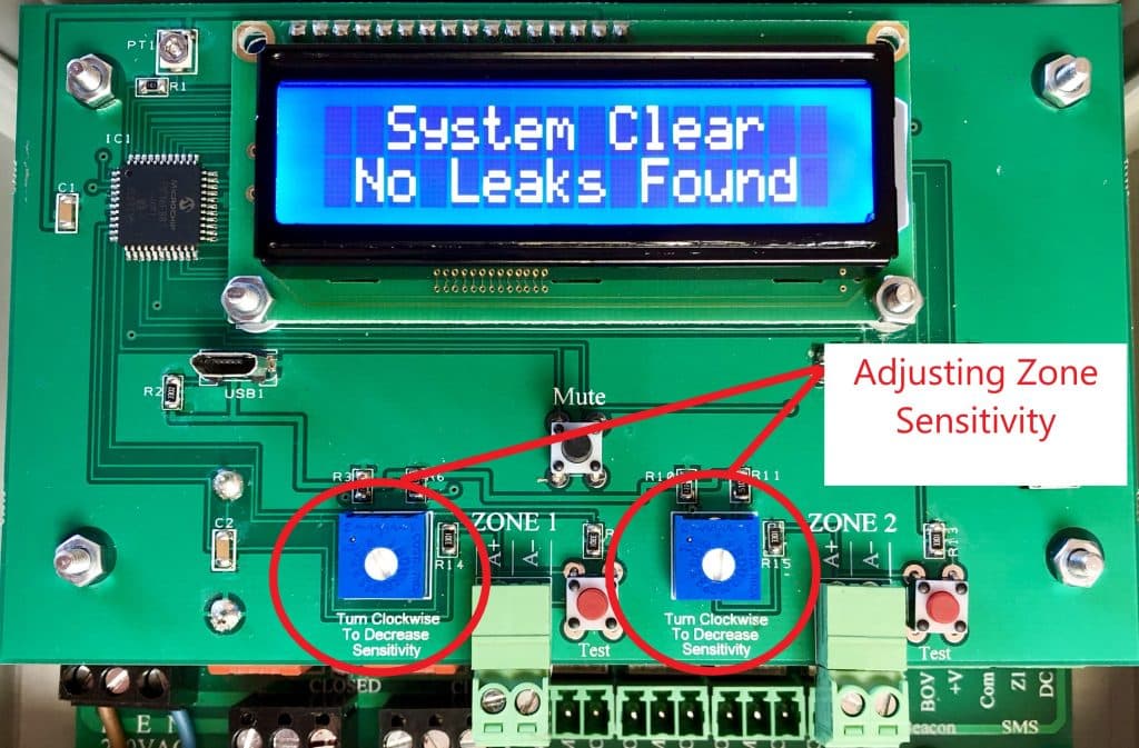 Close-up of LD2-3 water leak alarm showing the 10K potentiometers used to adjust Zone 1 and Zone 2 sensitivity.